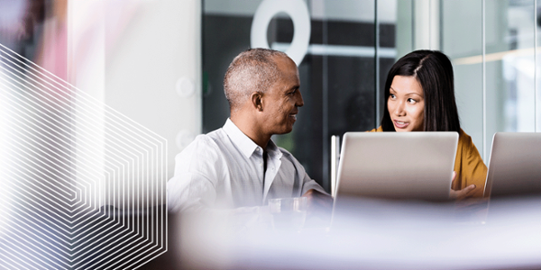 digital transformation - male and female sitting at desk